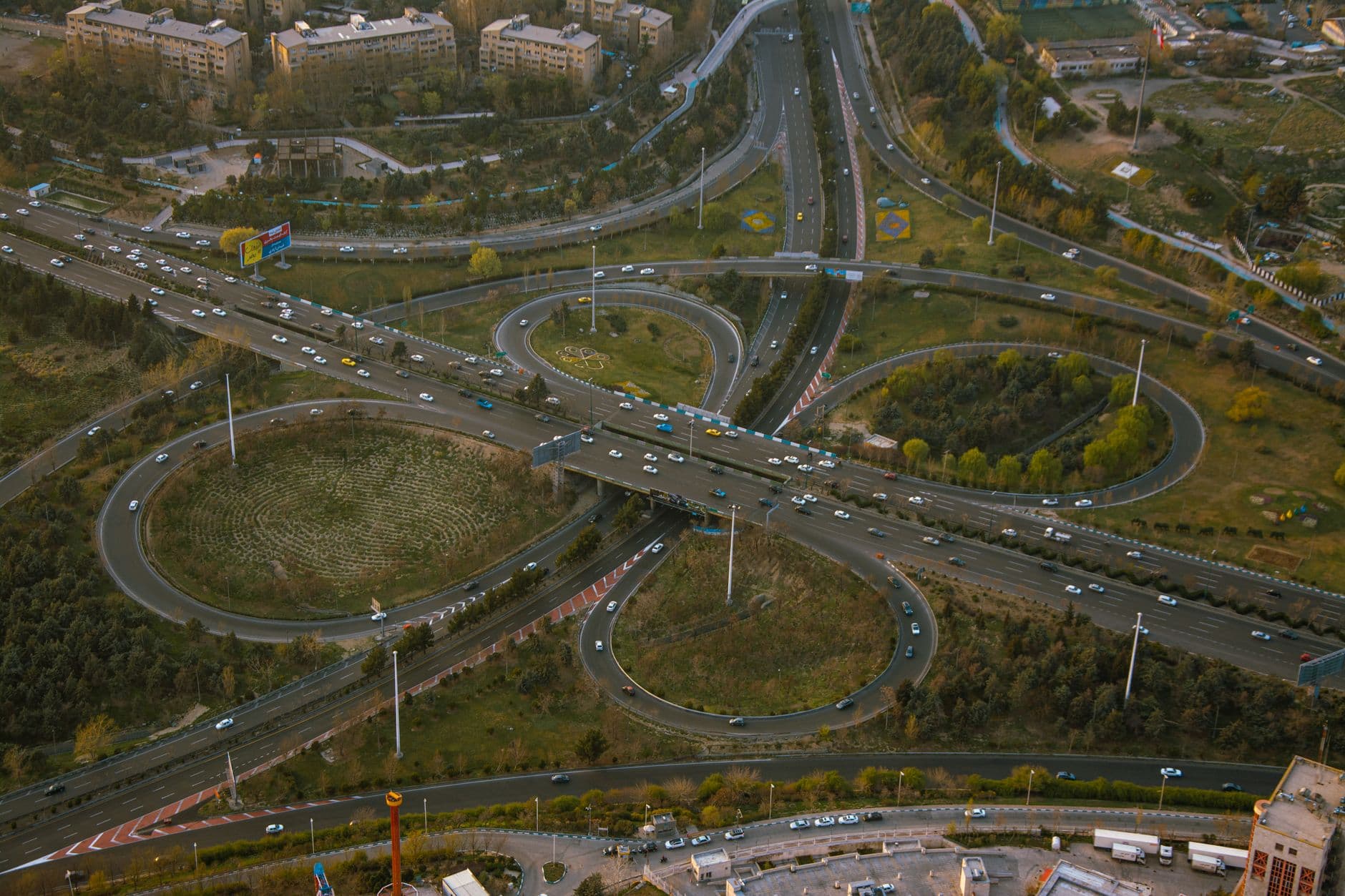 Aerial view of a complex highway interchange showcasing urban traffic patterns at daytime.